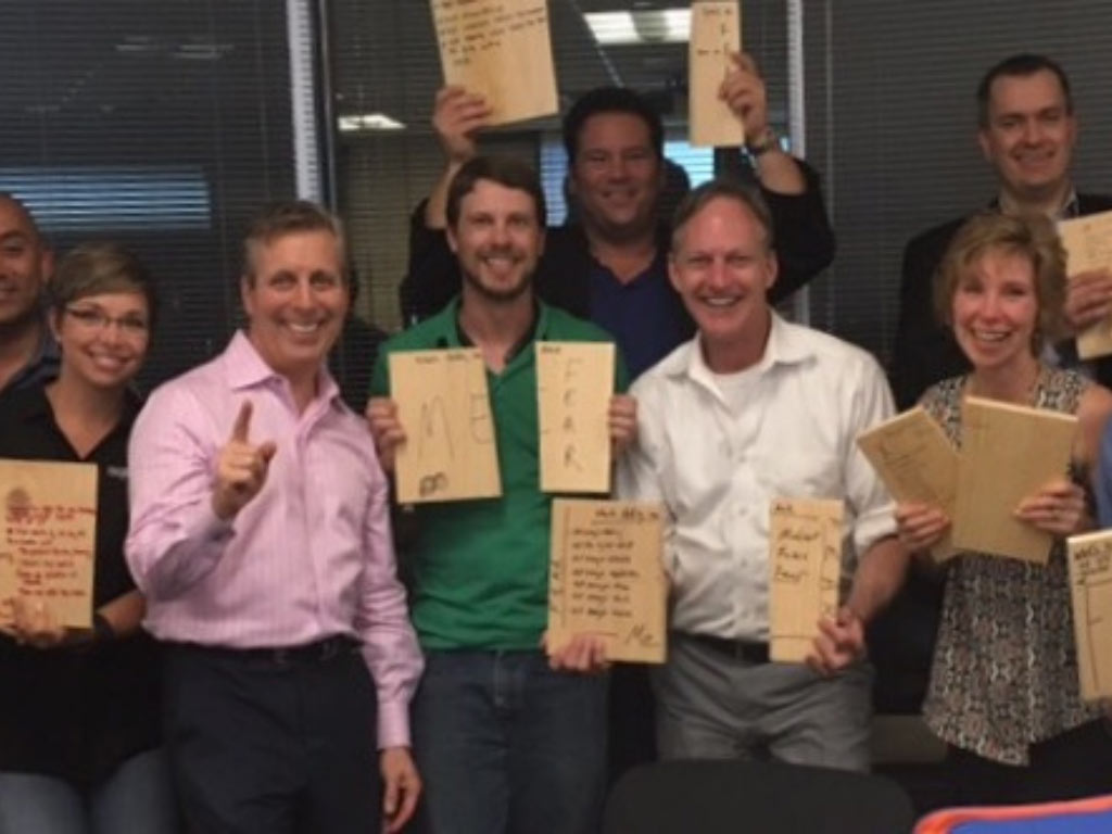EPIC agents holding up worksheets after a group exercise